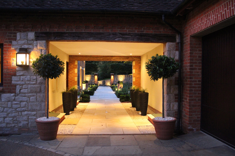 Photo of a mid-sized contemporary courtyard formal garden in Surrey.