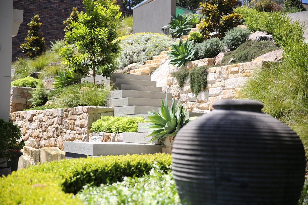 Design ideas for a mid-sized contemporary full sun backyard stone garden path in Sydney for summer.