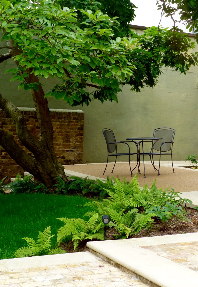 Design ideas for a medium sized traditional back partial sun garden for summer in London.
