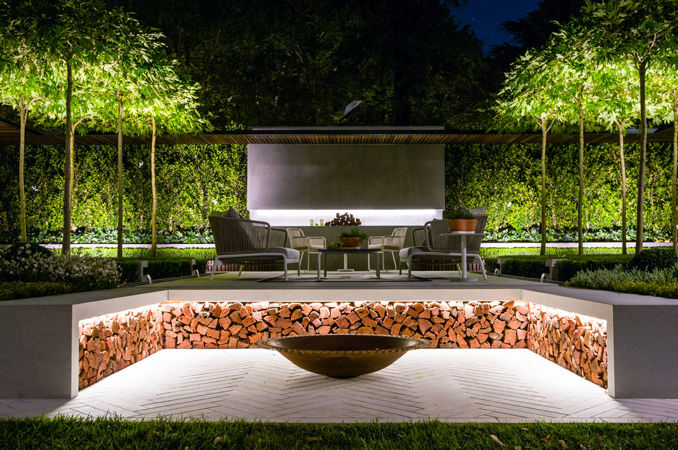 Inspiration for a contemporary concrete paver landscaping in Melbourne with a fire pit.