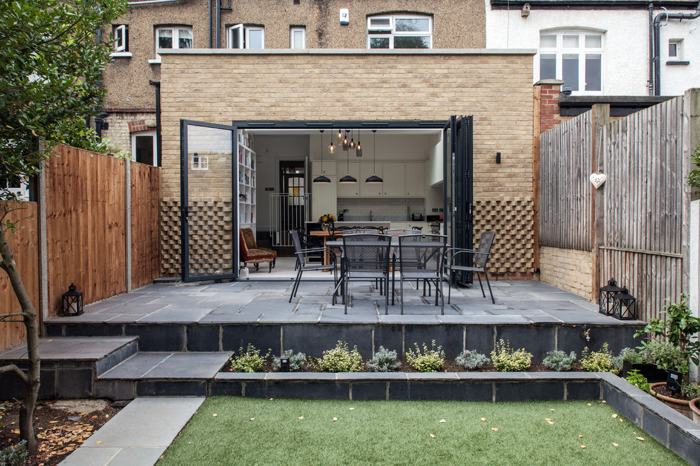 Photo of a transitional landscaping in London.