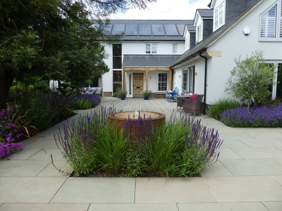 This is an example of a large contemporary full sun backyard landscaping in Cheshire.