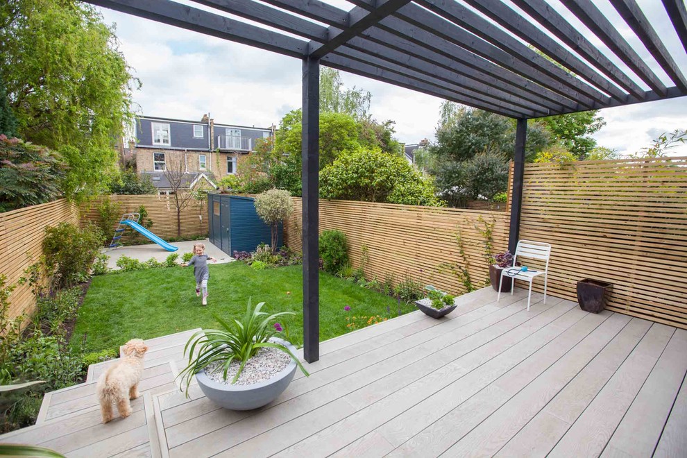 Design ideas for a contemporary landscaping in Hampshire with a pergola.