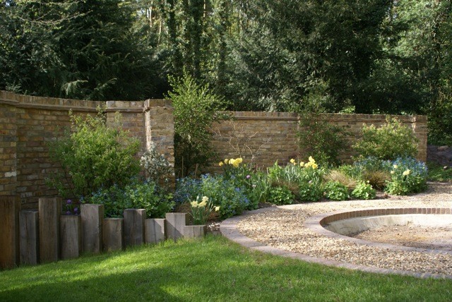Design ideas for a medium sized country back partial sun garden in Cheshire.