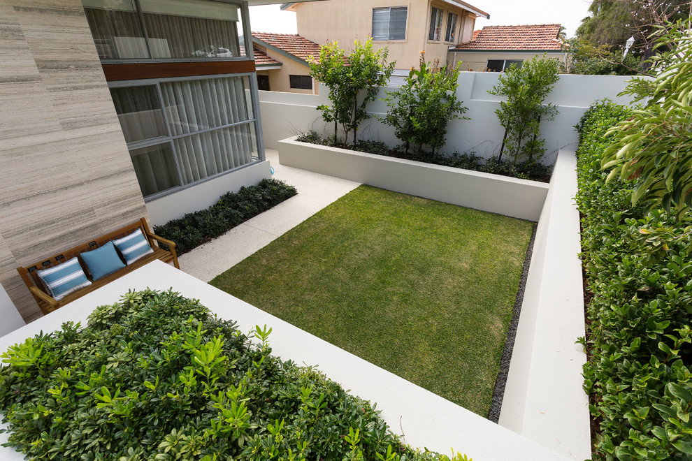 This is an example of a large partial sun backyard stone landscaping in Perth for summer.