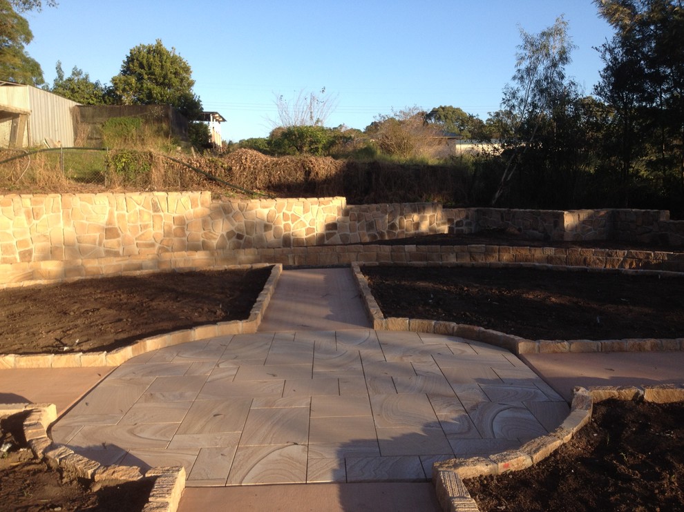 Design ideas for a medium sized classic back garden in Brisbane with a garden path and natural stone paving.
