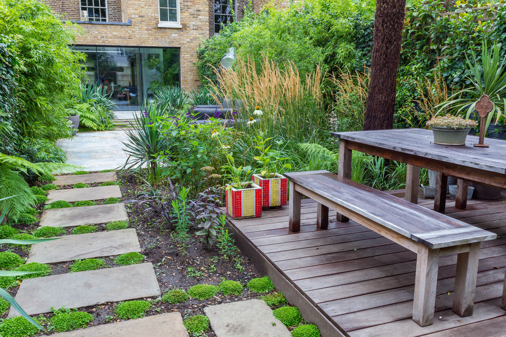 Medium sized contemporary back garden in London with decking.
