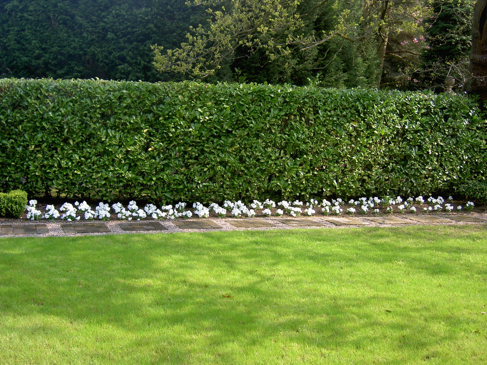 This is an example of a large classic back garden for summer in Cheshire.