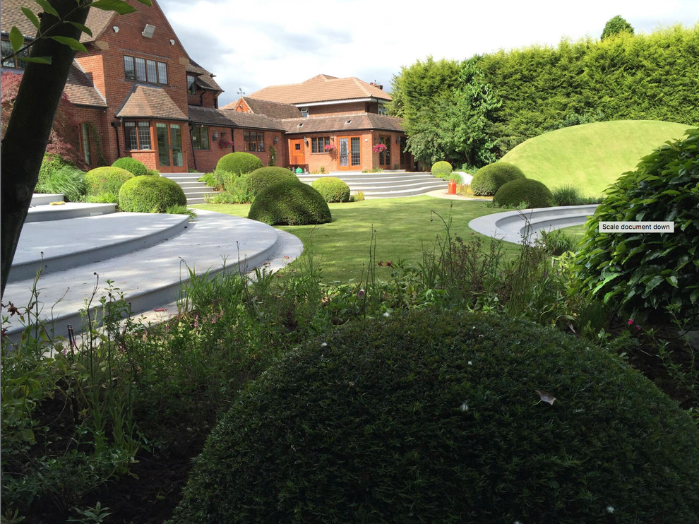 Idee per un grande giardino formale country dietro casa con pavimentazioni in pietra naturale