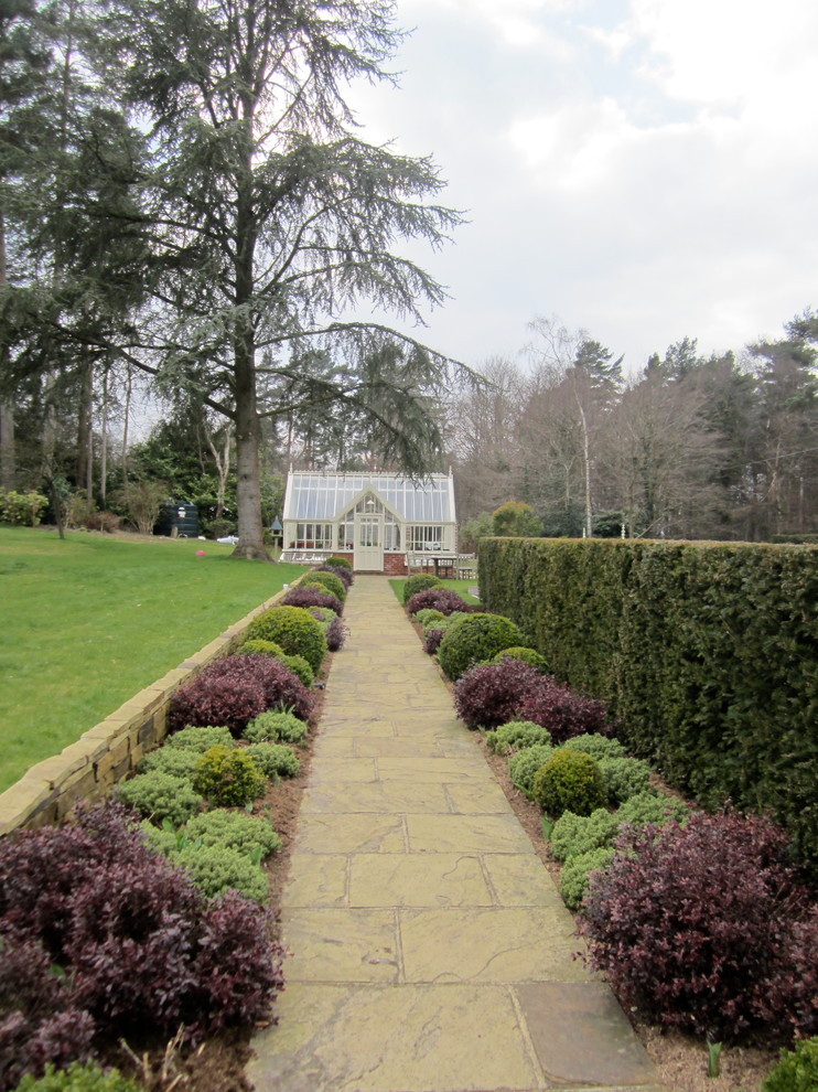 Photo of a classic side garden in Sussex with a garden path.