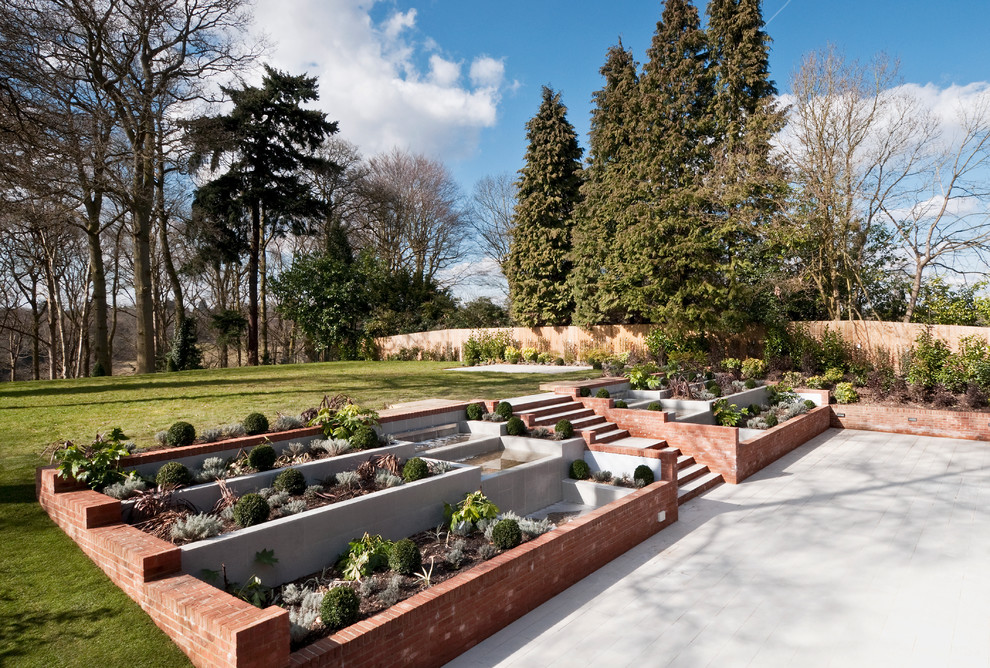 Idées déco pour un jardin en pots contemporain avec une exposition ensoleillée et une pente, une colline ou un talus.