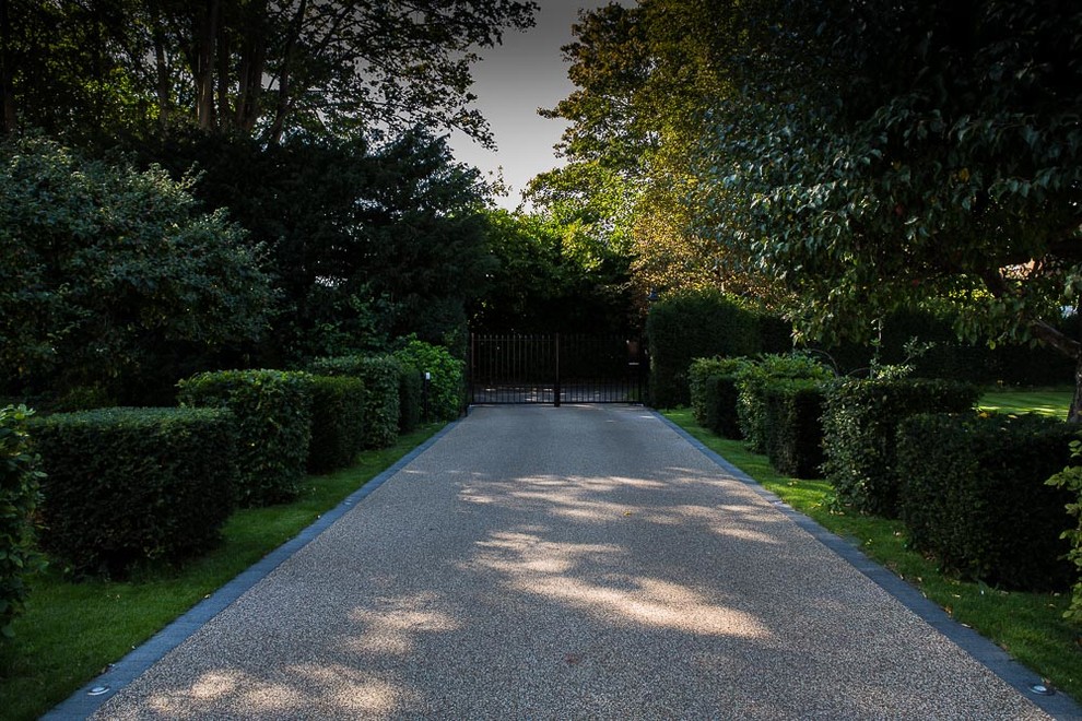 Design ideas for a medium sized classic front driveway full sun garden for summer in Buckinghamshire with a garden path.