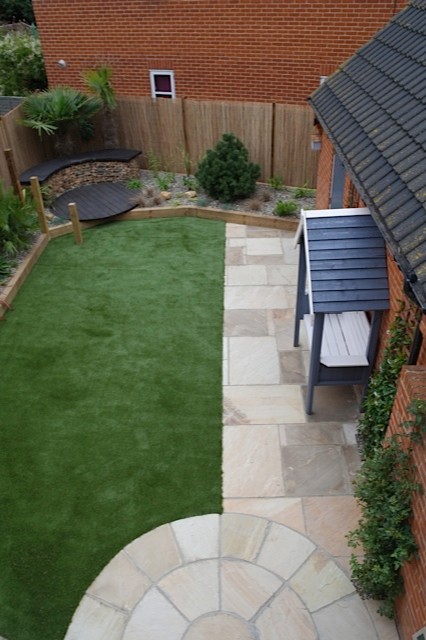 Photo of a small nautical back formal partial sun garden in Other with natural stone paving and a garden path.