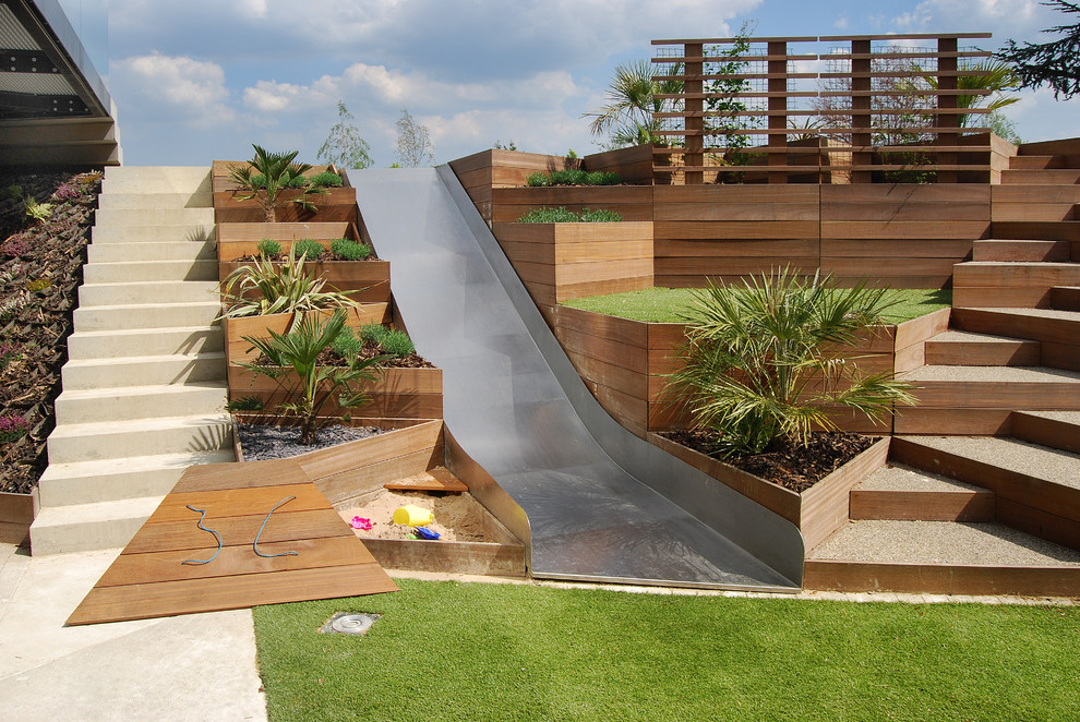 Design ideas for a contemporary garden in London with a climbing frame.