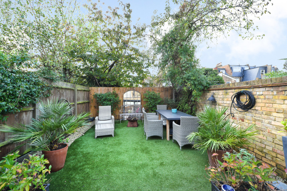 This is an example of a bohemian full sun garden in London.