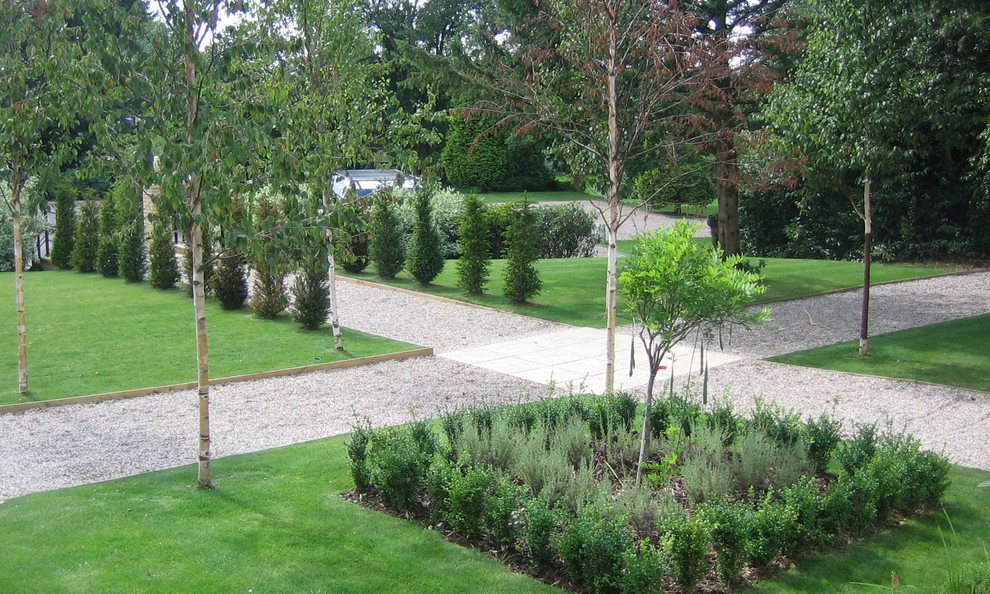 Photo of a large traditional back formal garden in Hertfordshire with a garden path.