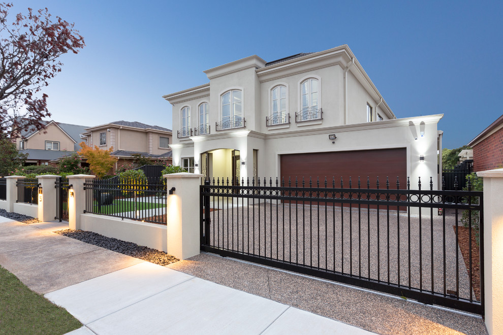 Modern front driveway garden in Melbourne with a garden path and natural stone paving.