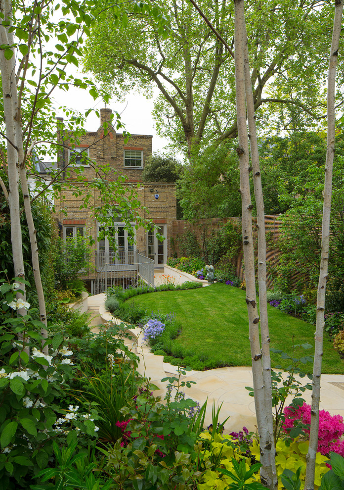 Photo of a contemporary back formal garden in London with a garden path.