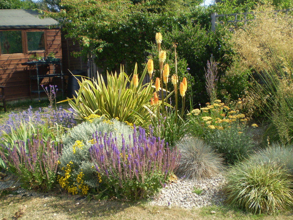 Design ideas for a medium sized mediterranean garden in Sussex.