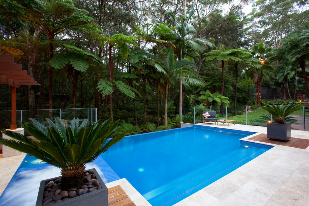 This is an example of a mid-sized contemporary backyard landscaping in Sydney.
