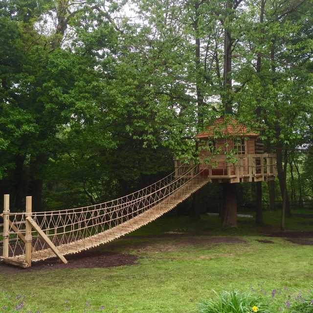 Log Rope Bridge leading to a 'floating' suspended treehouse Rustic