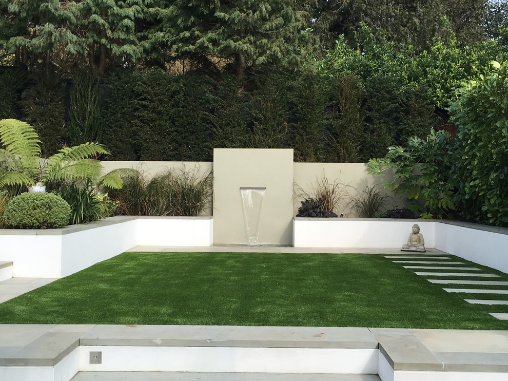 Contemporary formal garden in Essex with a water feature.