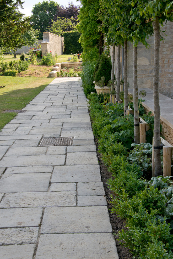 Design ideas for a large traditional formal garden in Oxfordshire with a garden path and concrete paving.