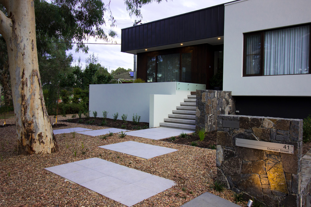 Immagine di un giardino formale design esposto in pieno sole di medie dimensioni e davanti casa in primavera con pavimentazioni in pietra naturale