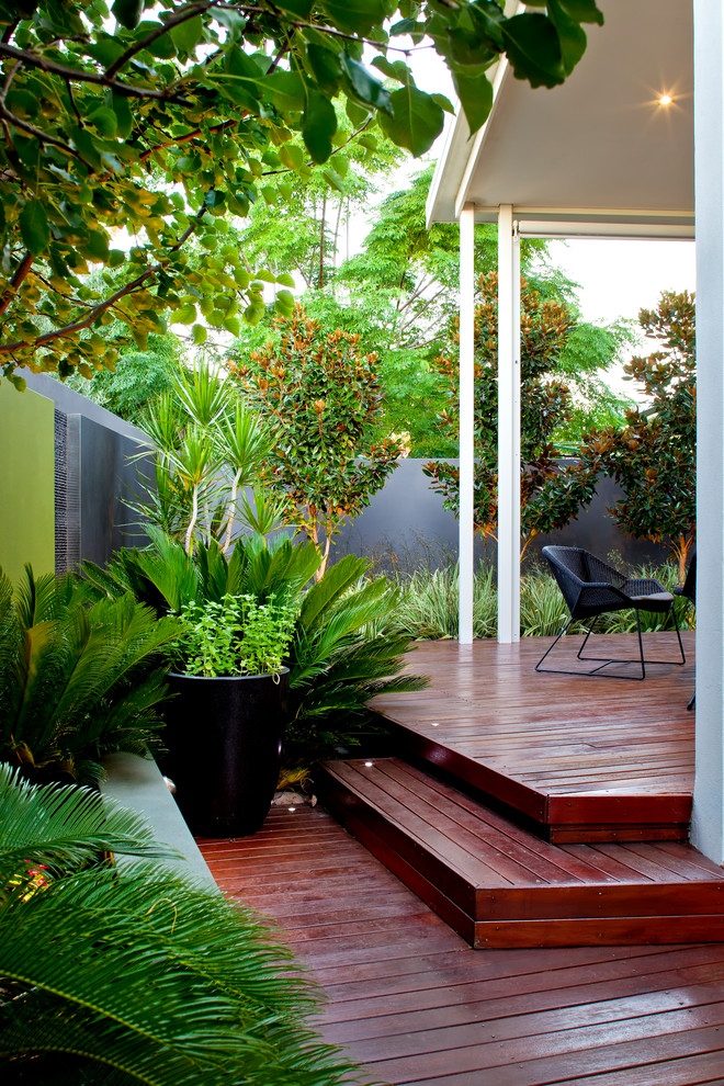Inspiration for a small contemporary full sun courtyard water fountain landscape in Perth with decking.