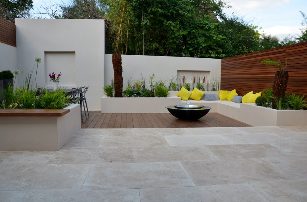 Example of a small trendy backyard patio design in London
