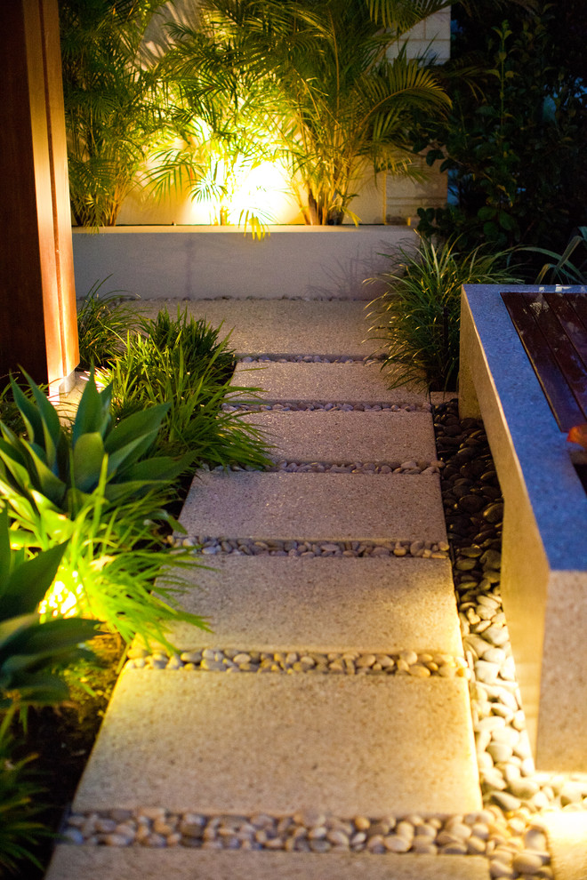 Photo of a mid-sized modern front yard stone garden path in Perth.