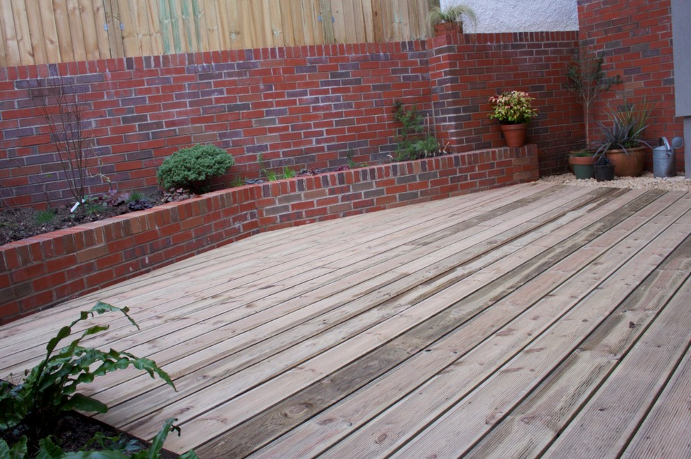 Small contemporary back garden in Other with decking.
