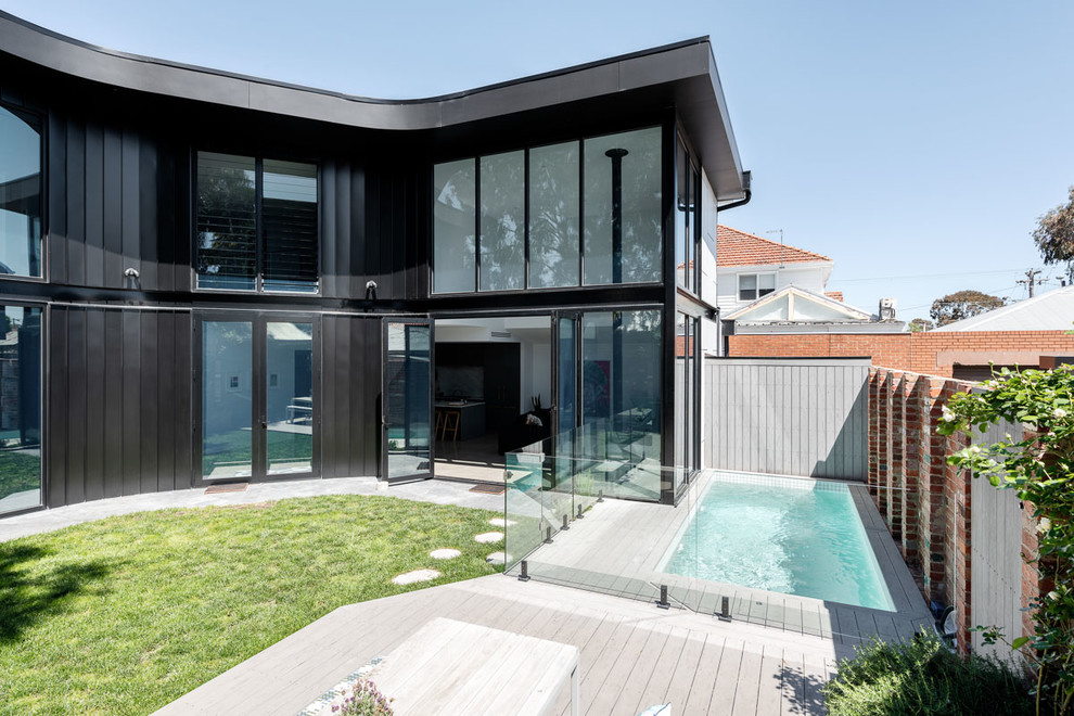 This is an example of a medium sized contemporary back garden for summer in Melbourne.