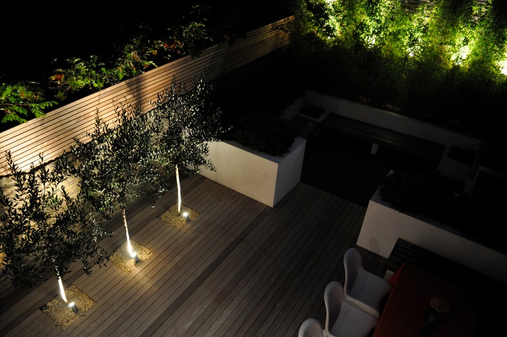 Design ideas for a medium sized contemporary back formal full sun garden in London with decking.