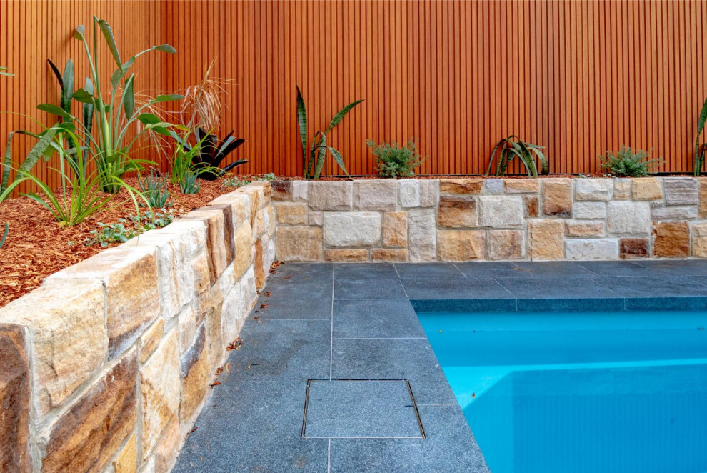 Inspiration for a contemporary back private garden in Sydney with decking.