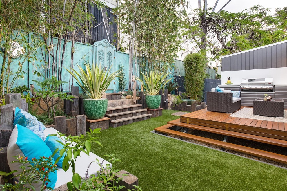 Inspiration for an eclectic courtyard garden for summer in Brisbane with an outdoor sport court and decking.
