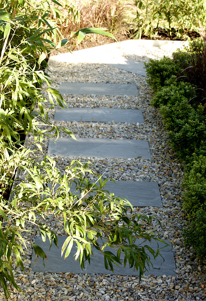 Photo of a small contemporary full sun stone garden path in Perth.