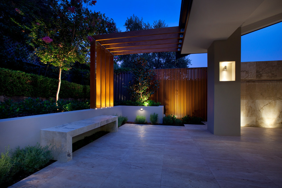 This is an example of a large contemporary backyard stone water fountain landscape in Perth.