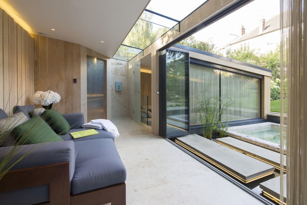 Contemporary back garden in London with natural stone paving.
