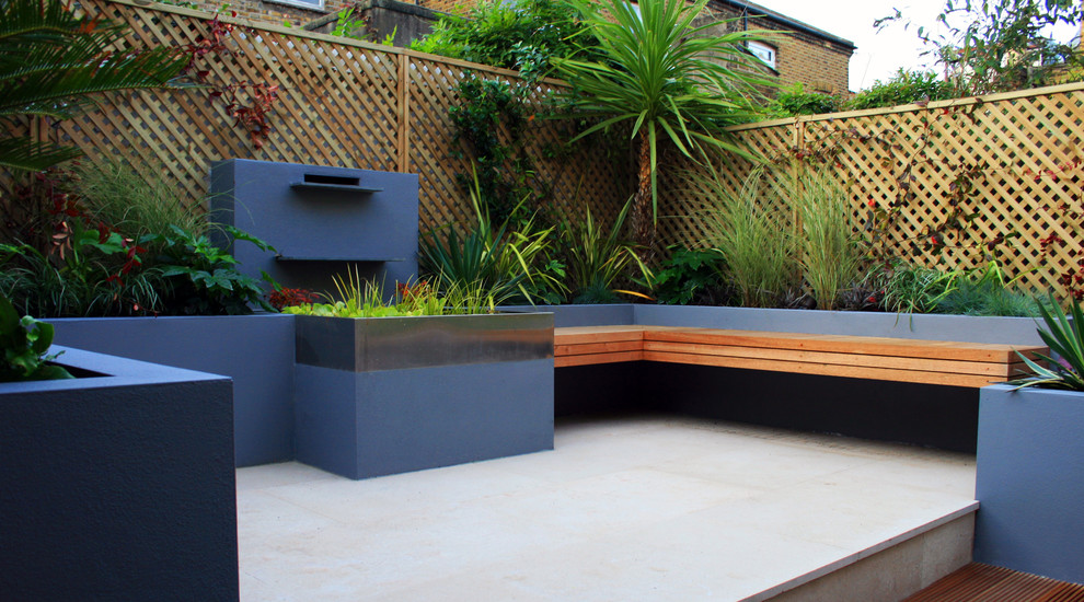 Inspiration for a small contemporary partial sun backyard landscaping in London.