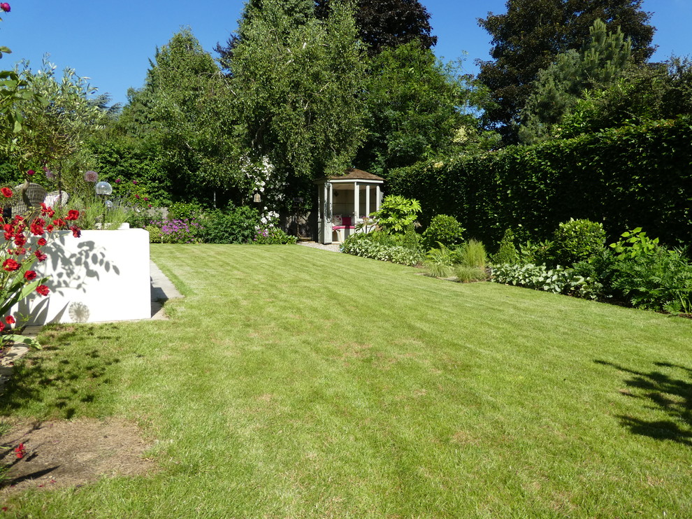 Medium sized contemporary back full sun garden in Cheshire.