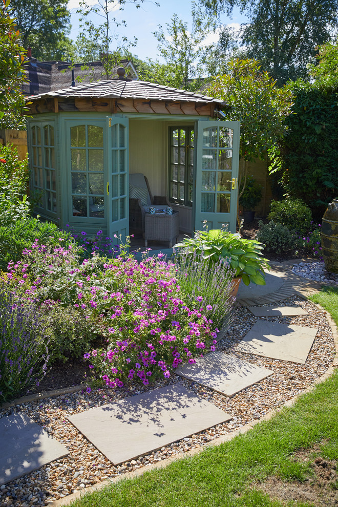 This is an example of a small classic garden in Cheshire.