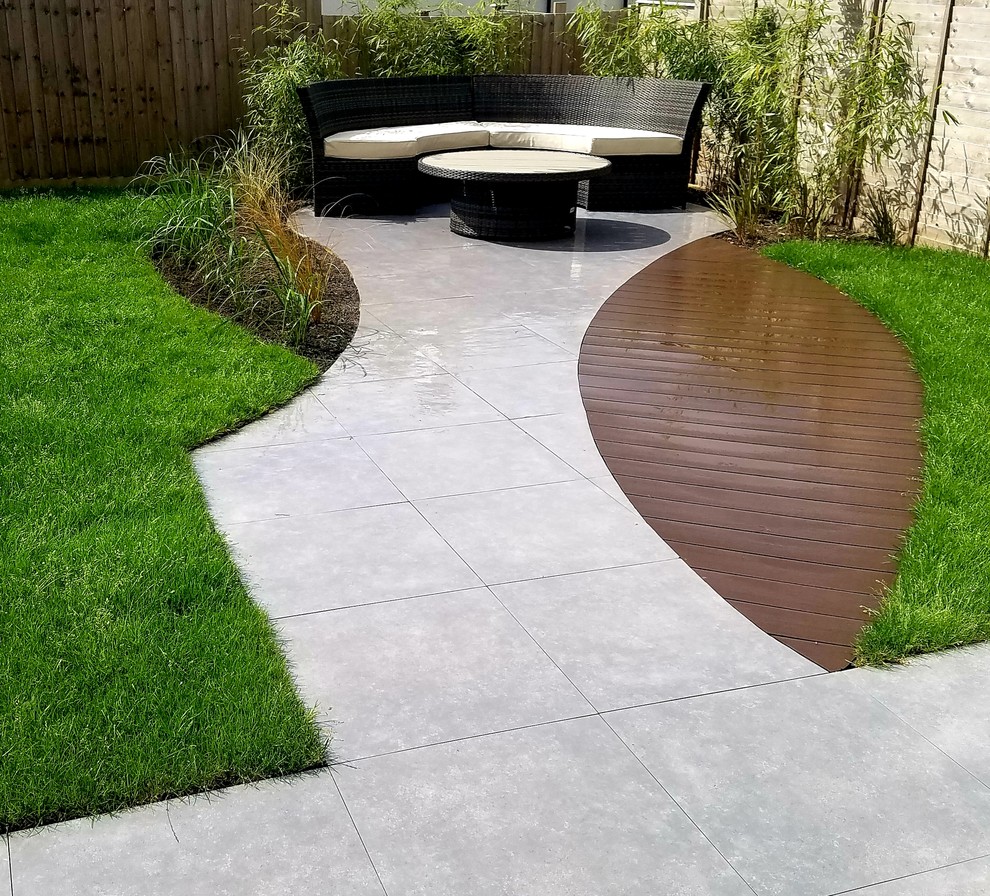 Inspiration for a medium sized modern back full sun garden in Gloucestershire with natural stone paving.