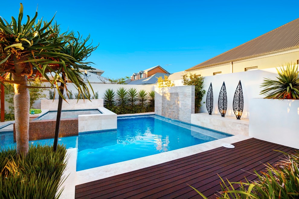 Mid-sized minimalist backyard pool photo in Perth