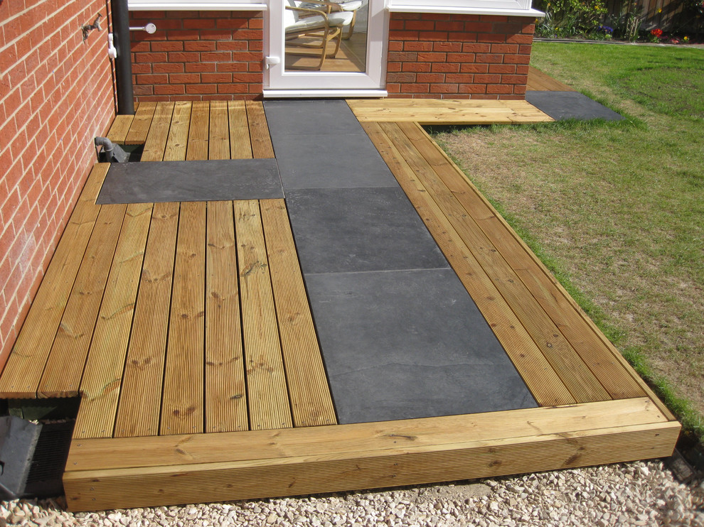 Small modern back fully shaded garden for summer in Other with decking.