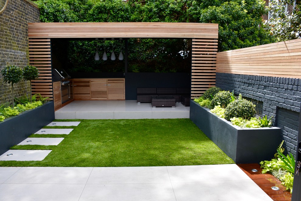 Design ideas for a medium sized contemporary back garden in London.