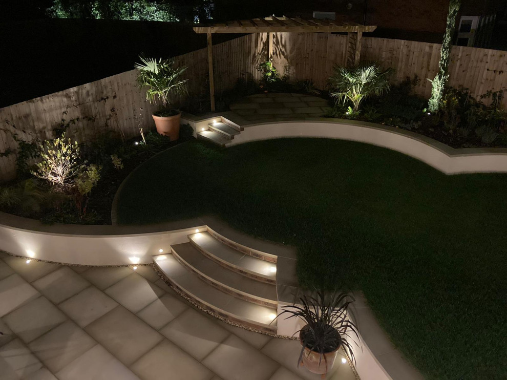 This is an example of a small modern backyard formal garden in Gloucestershire.