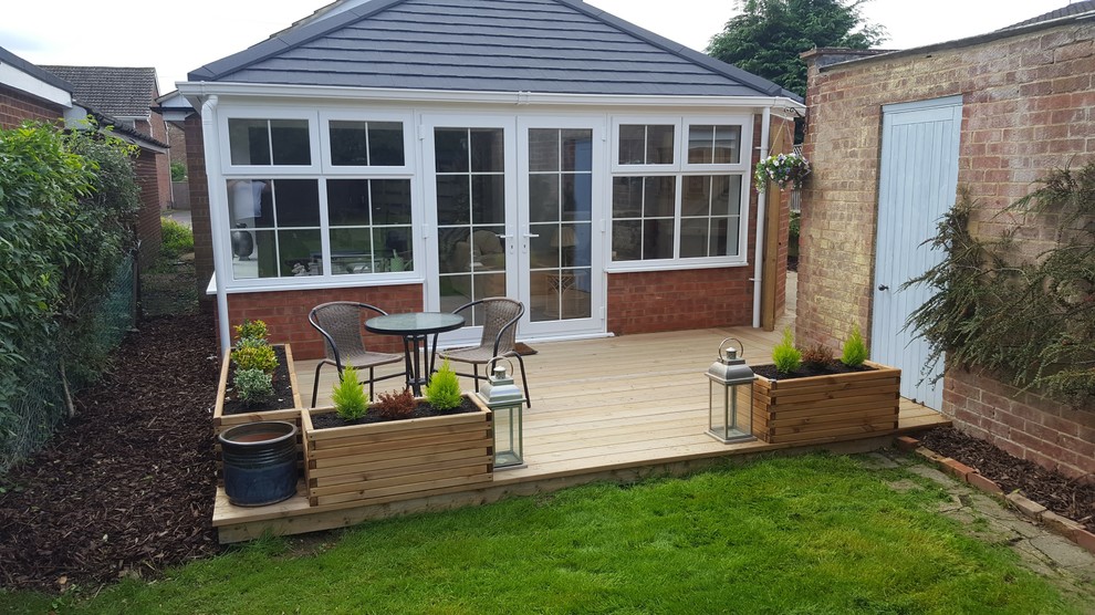 Photo of a small scandi back partial sun garden for summer in Buckinghamshire with decking.