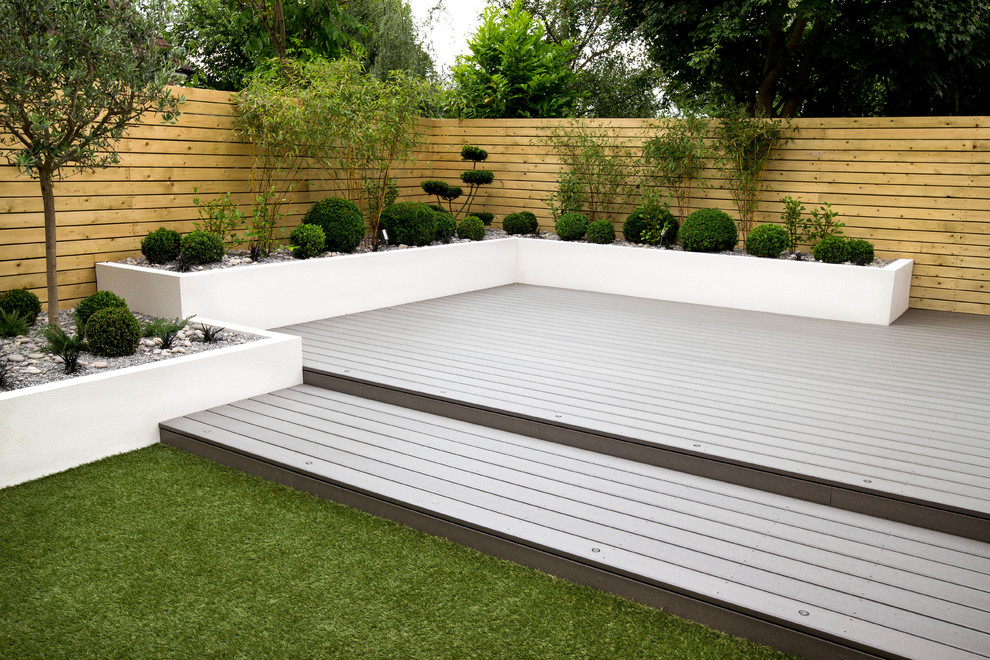 Inspiration for a small contemporary back fully shaded garden for summer in Other with a potted garden and decking.