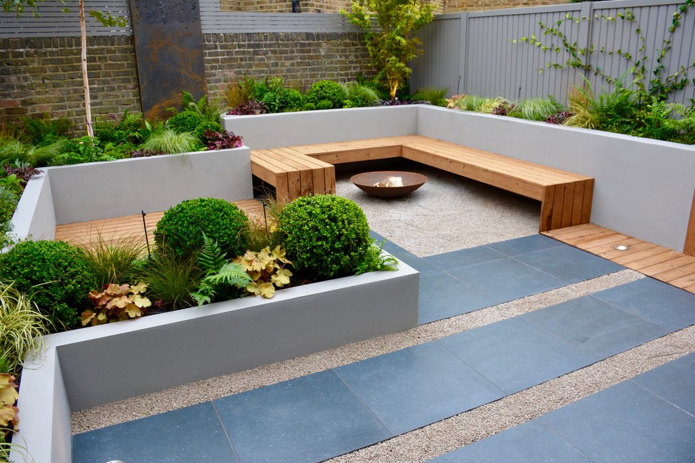 Design ideas for a small contemporary back partial sun garden in London.